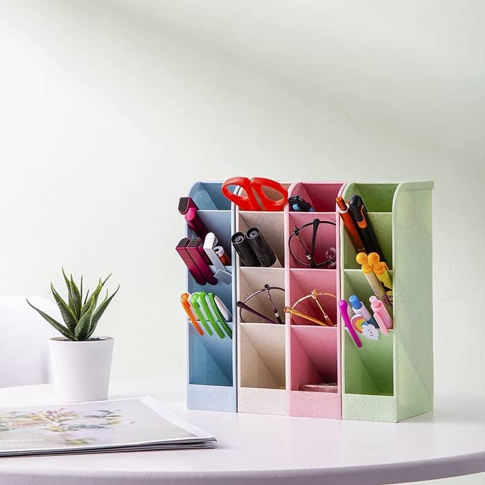 a rainbow stationery organizer with 16 compartments