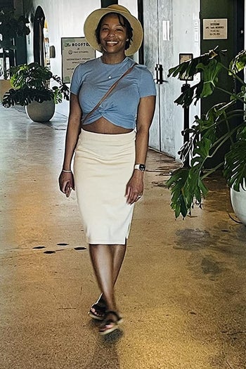 Reviewer wearing the blue crop top