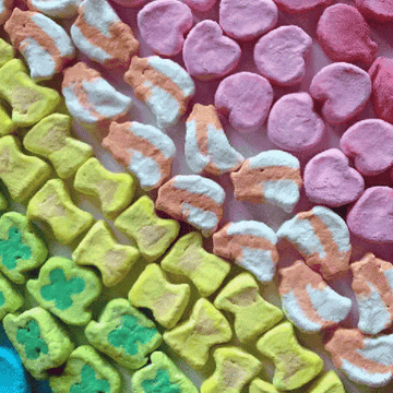 Rotating rows of different-colored charm-shaped marshmallow pieces