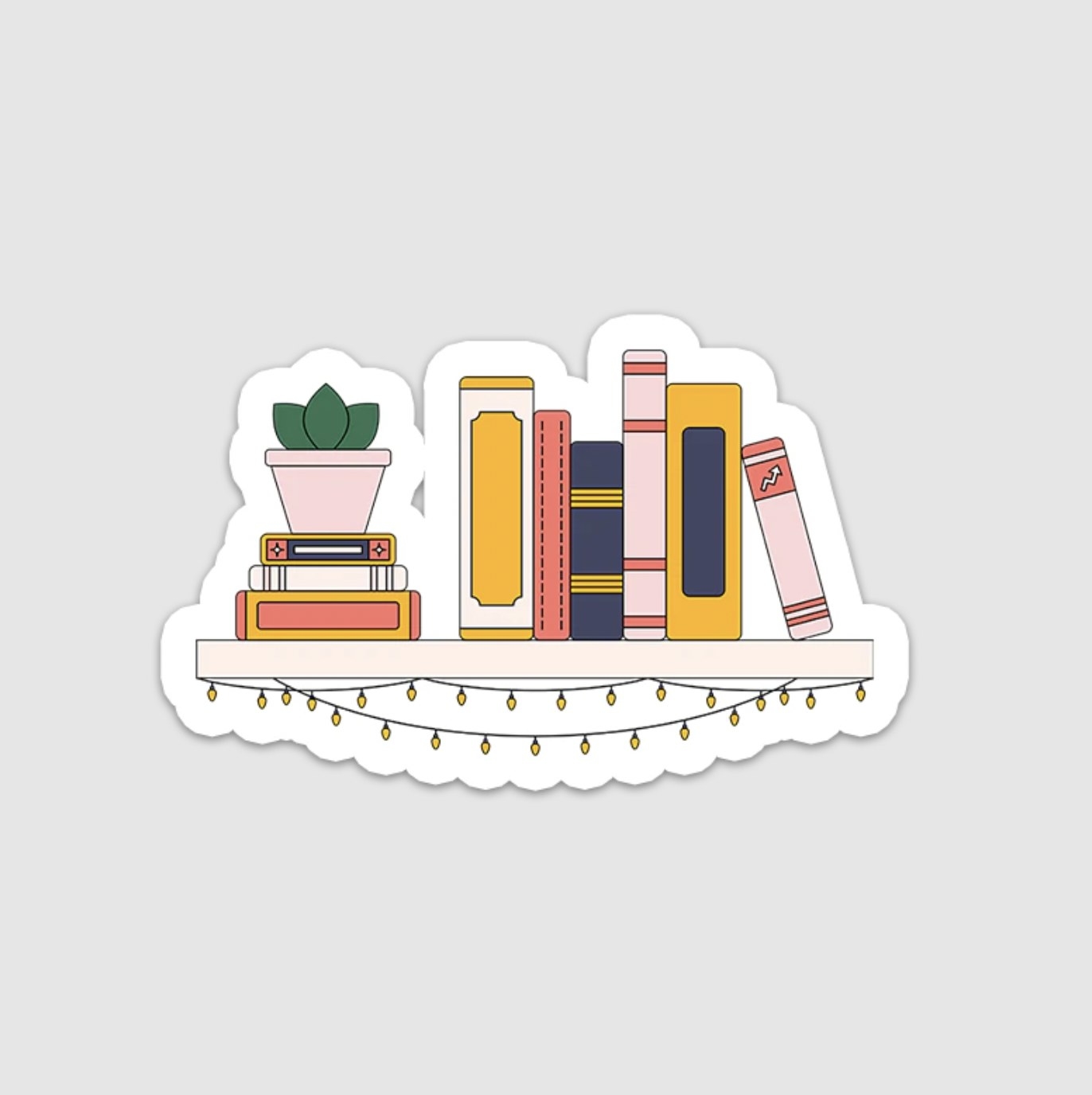 The irregular shaped sticker showing a bookshelf with hanging lights below and stacked books and a plant resting on top of the shelf