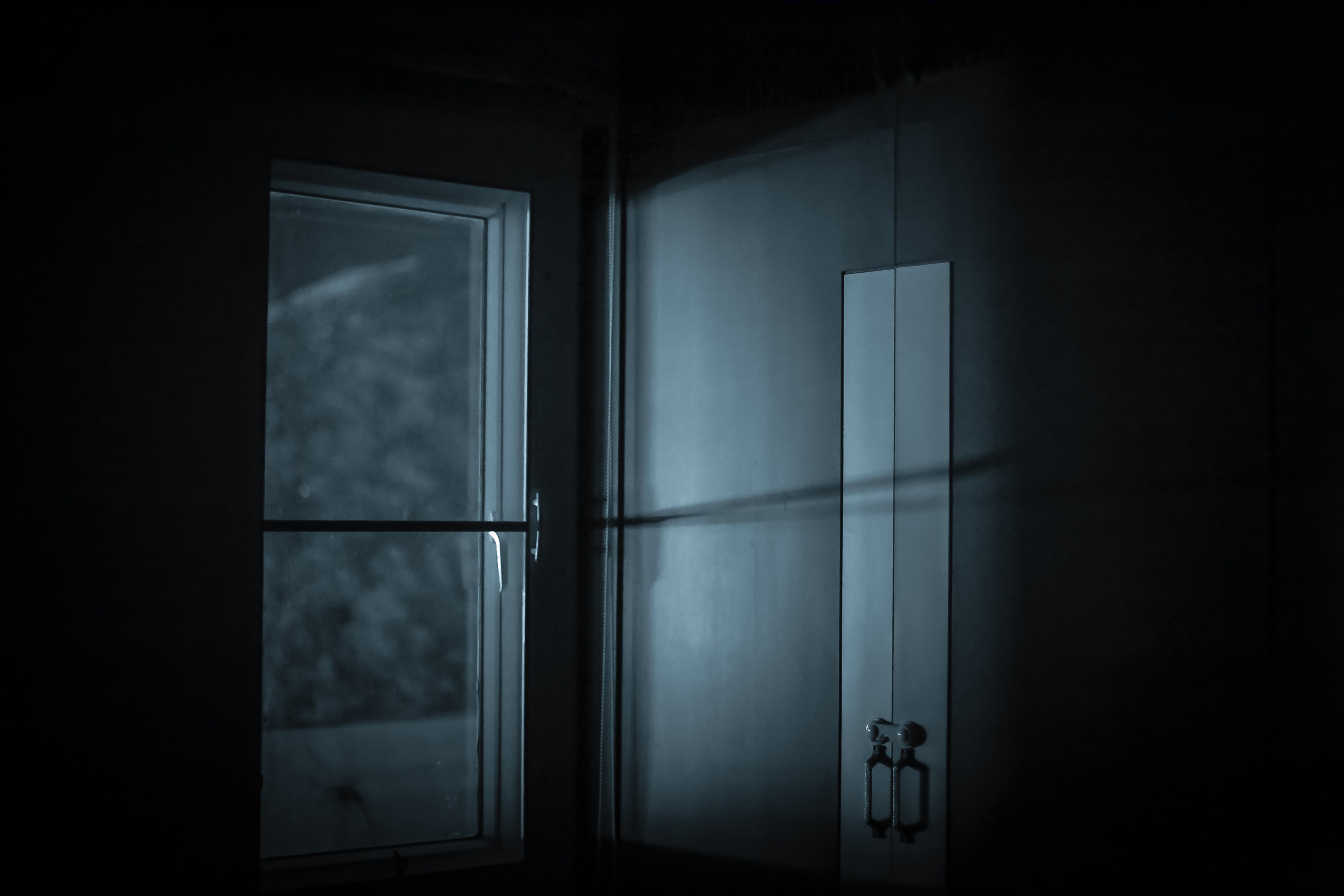 A door and window in the dark