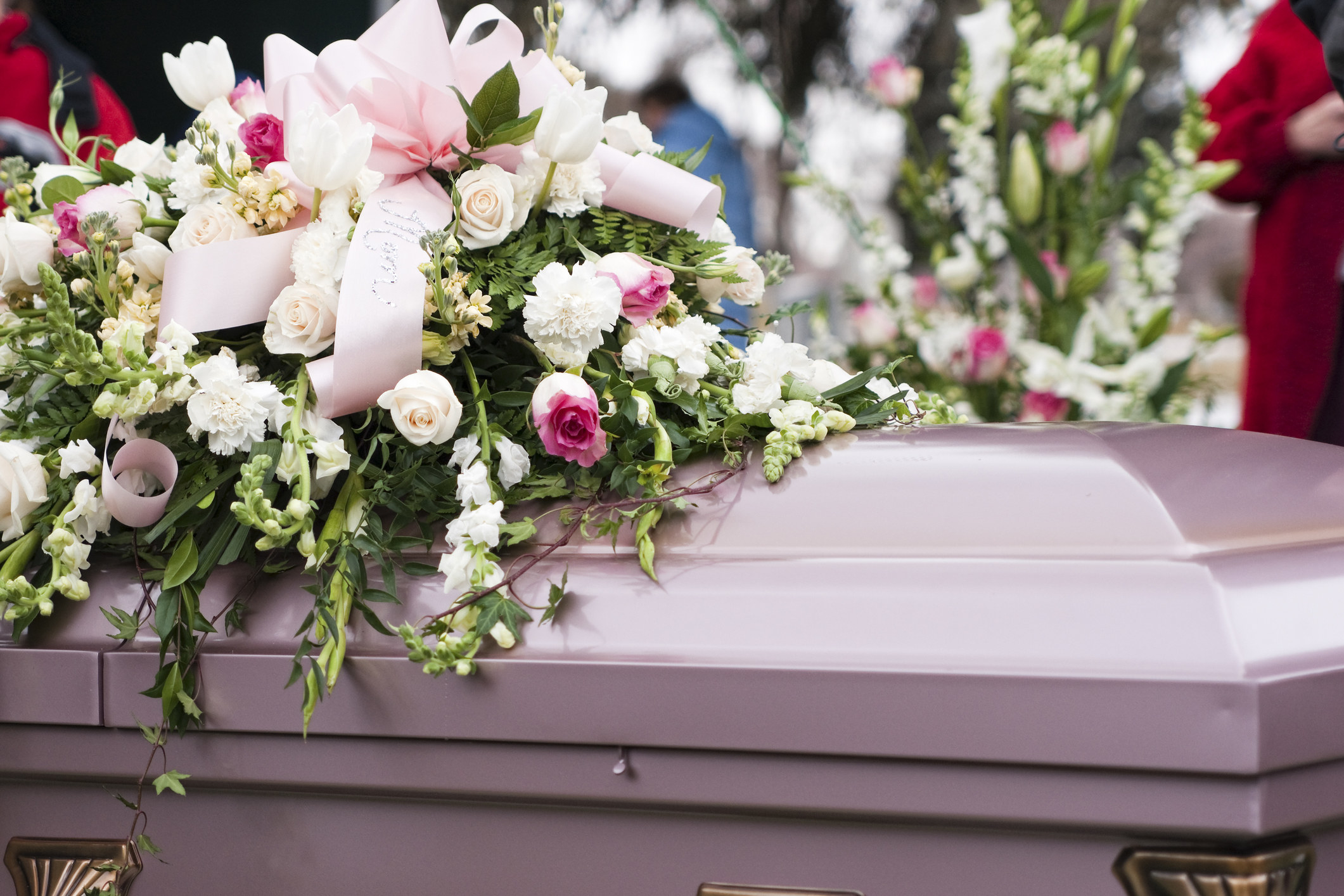a casket with flowers on it