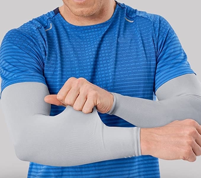 a person pulling on the stretchy sleeve