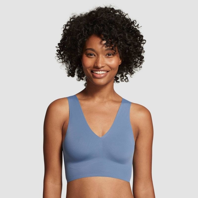 a model wearing the bra in light blue