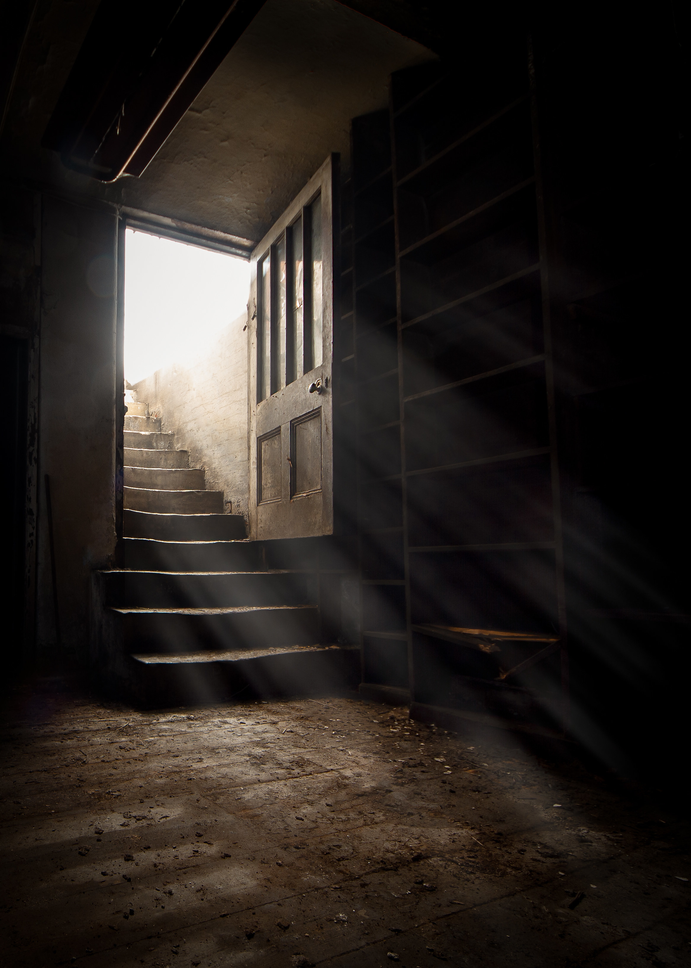 A basement door with light pouring in