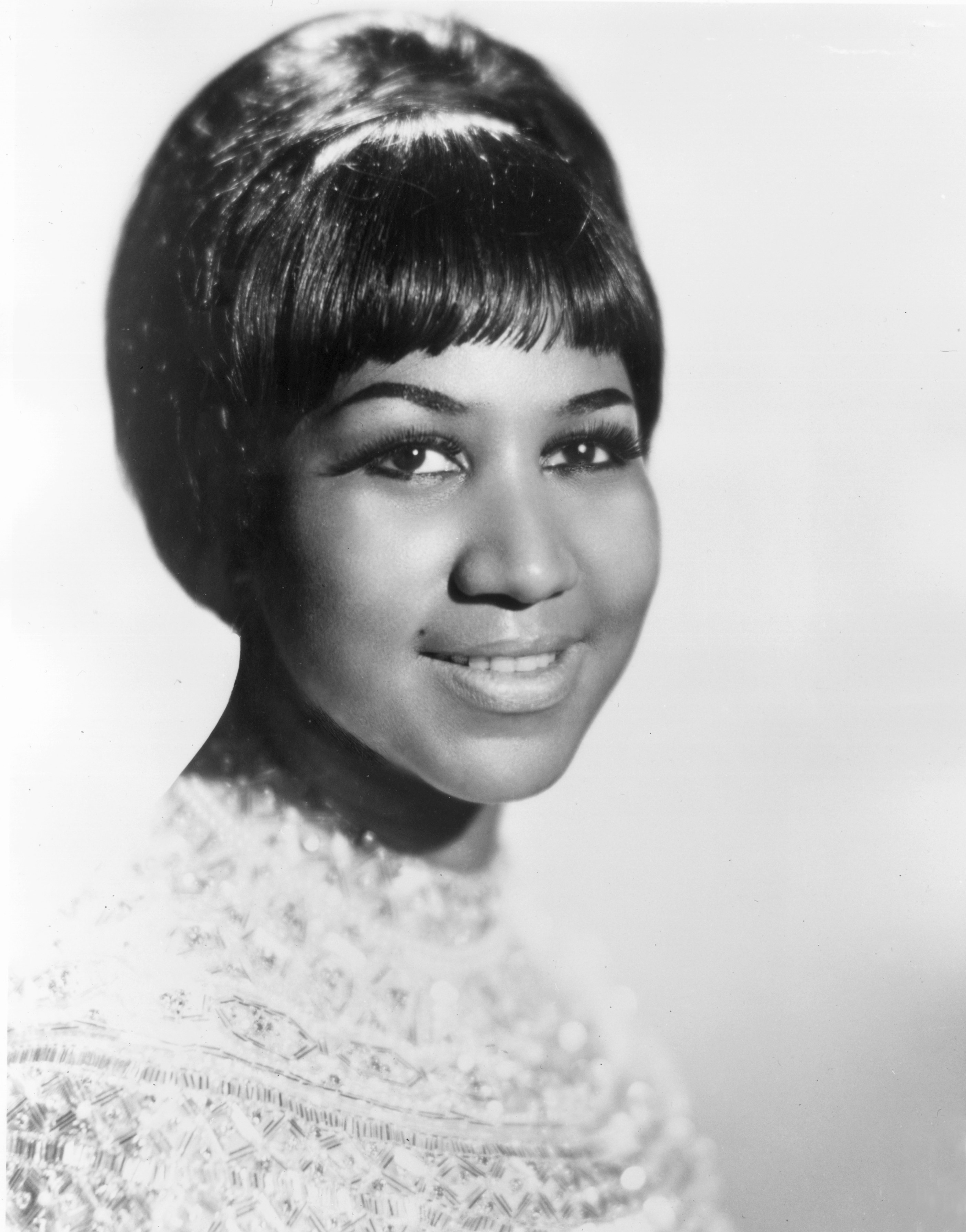 A portrait of a young Aretha Franklin
