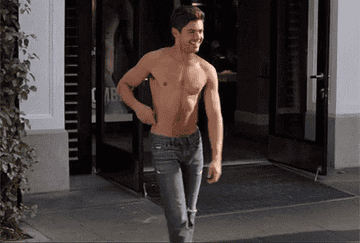 Zac Efron standing shirtless outside of an Abercrombie &amp;amp; Fitch in &quot;Neighbors&quot;
