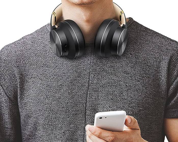 A closeup of somebody wearing a pair of headphones
