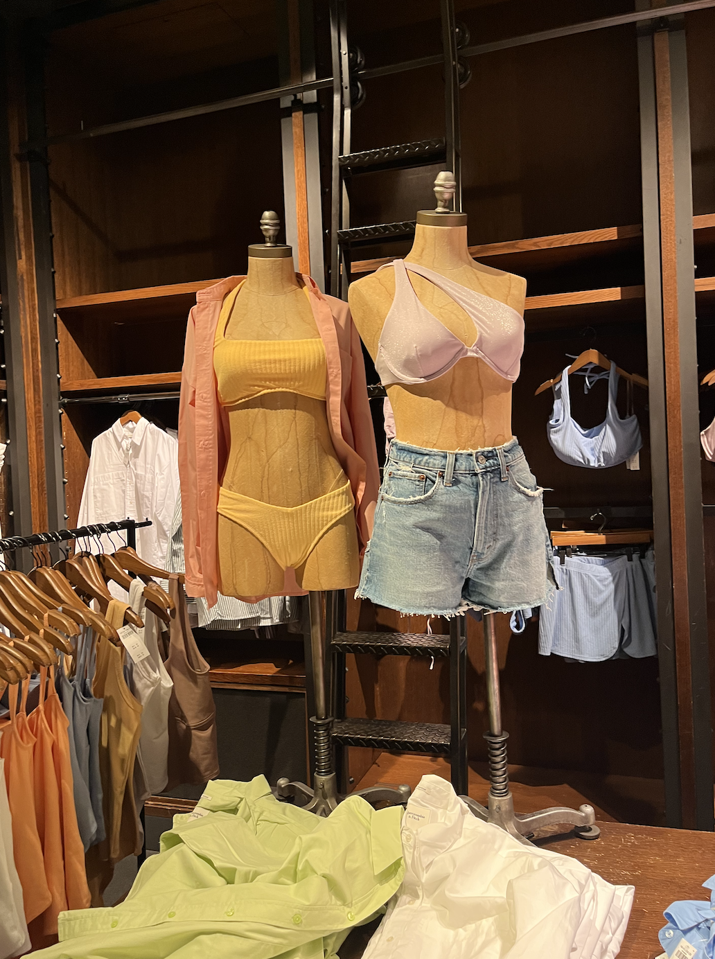 Bathing suits and shorts on display on headless mannequins