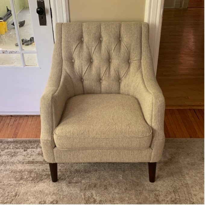 a reviewer photo of the chair in beige
