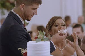 Barnett from Love Is Blind shoving wedding cake into Amber's mouth