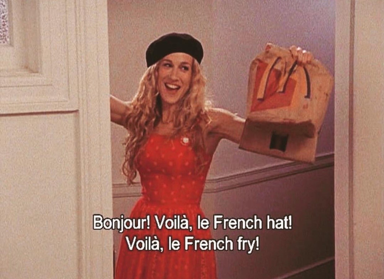Carrie Bradshaw entering a room saying, &quot;Bonjour! Voila, le French hat! Voila, le french fry!&quot;