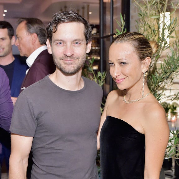Tobey Maguire and Jennifer Meyer smiling together at an event
