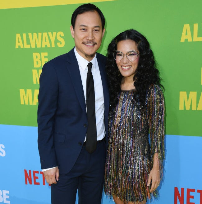 Ali Wong and Justin Hakuta smiling at a movie premiere
