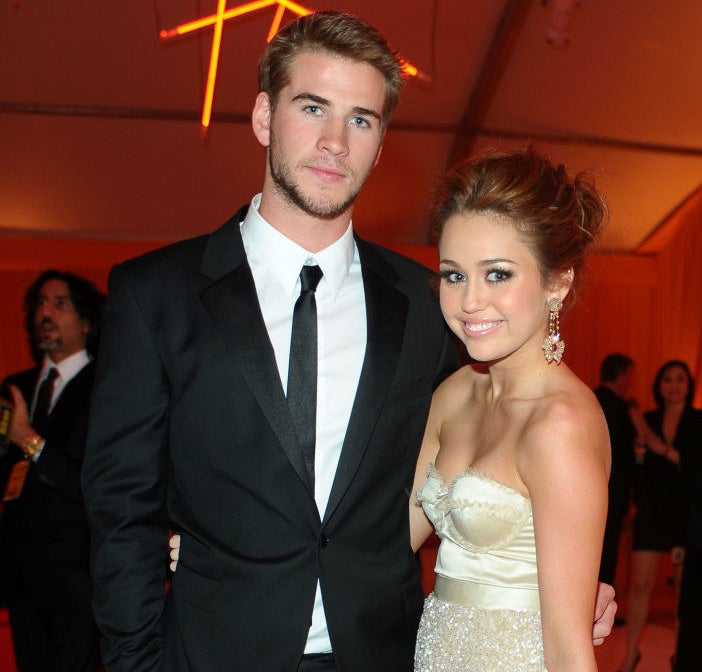 Miley Cyrus and Liam Hemsworth at an event several years ago