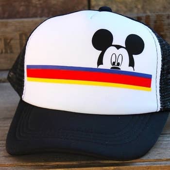 The baseball cap with stripes and a Mickey Mouse face