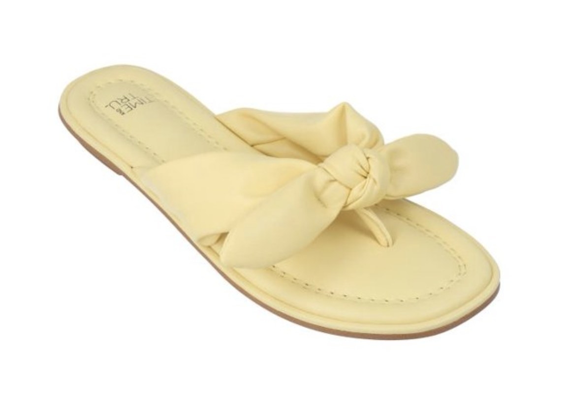 A pair of yellow bow slides