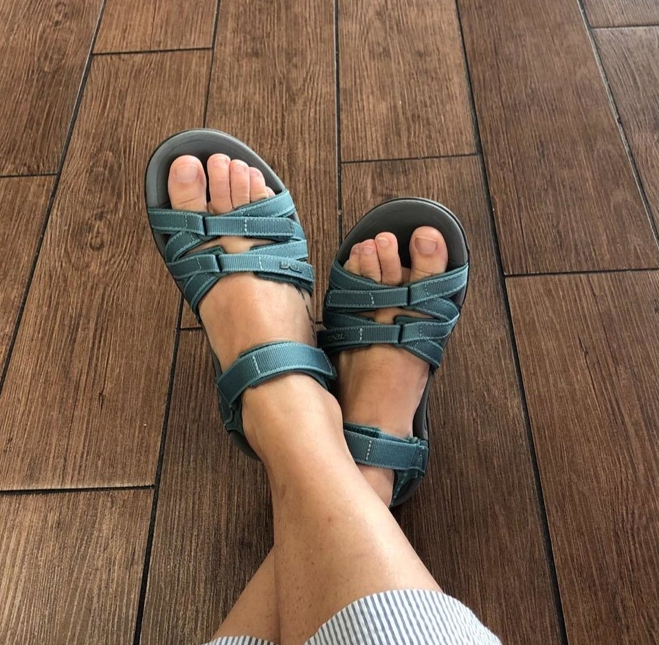reviewer photo of green teva sandals with three straps