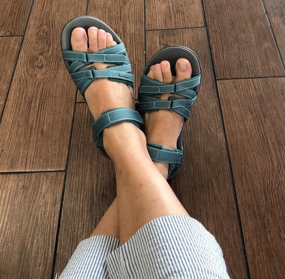 reviewer photo of green teva sandals with three straps