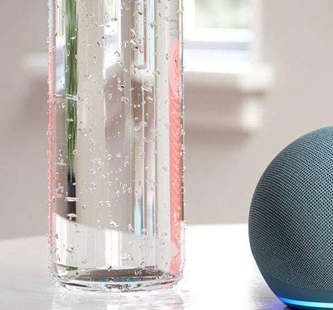 a round echo dot speaker on a white table