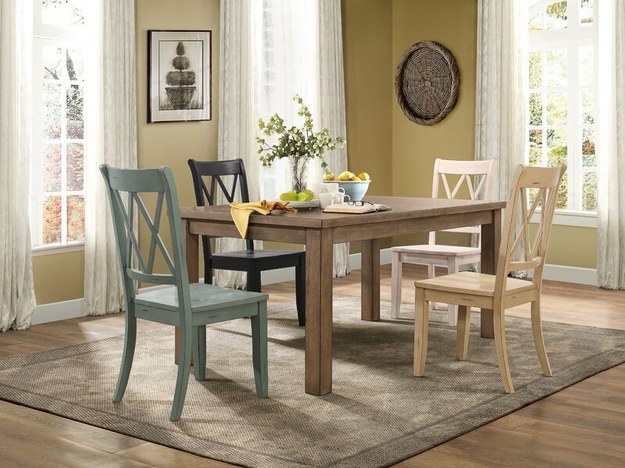 Home with multiple colors chairs at table