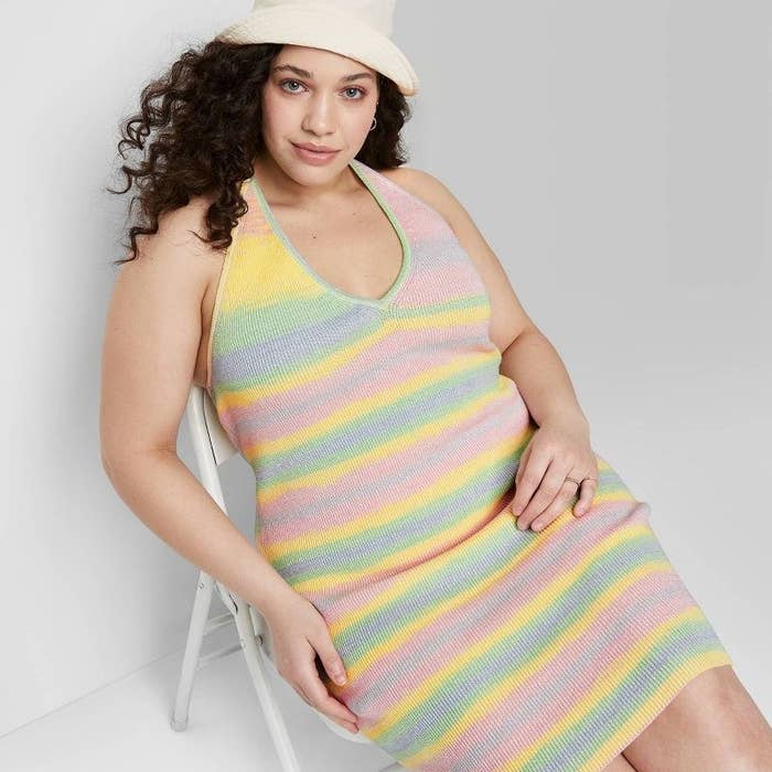 front view of model wearing the dress in pastel stripes