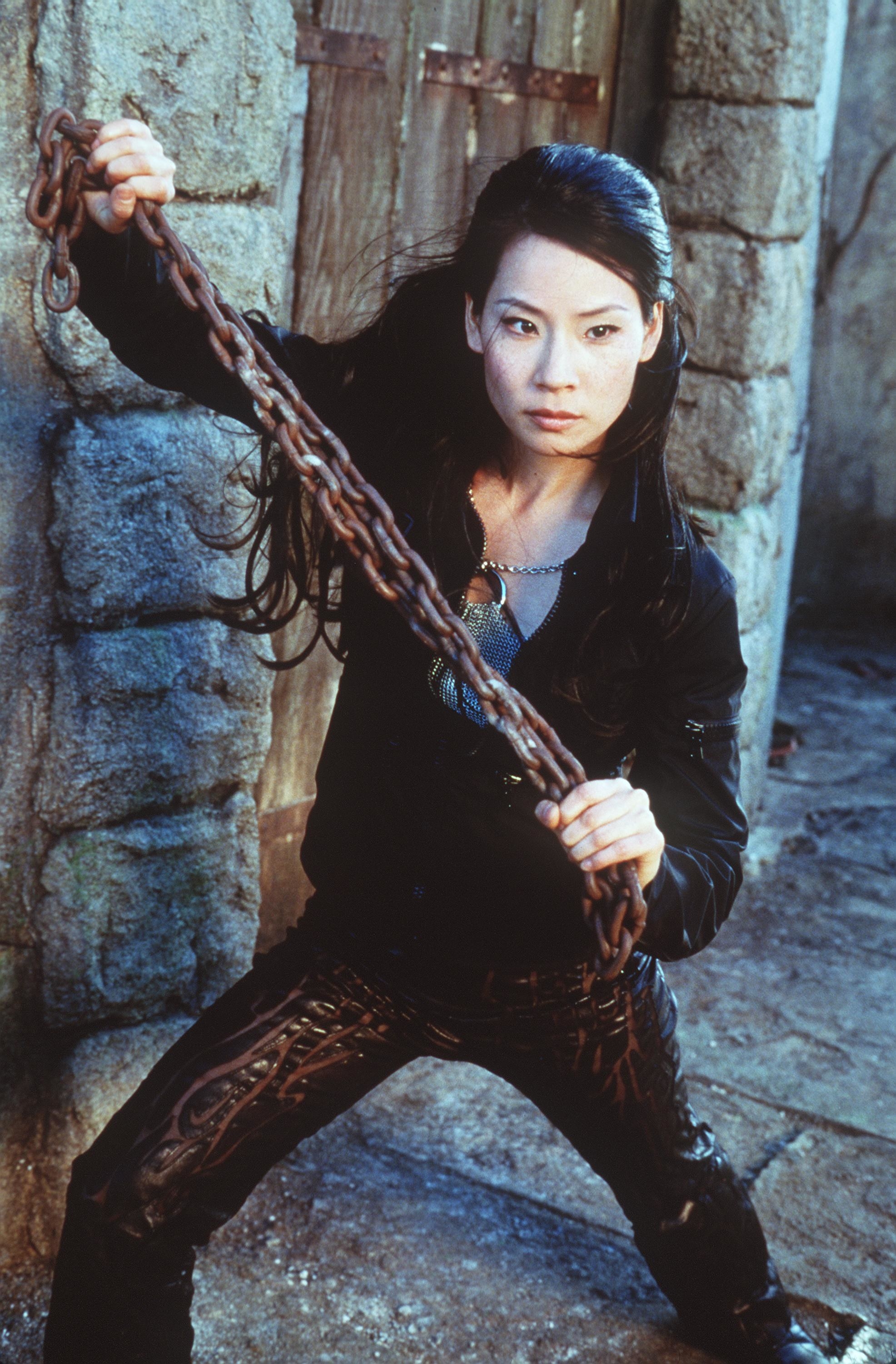 Liu holding chain and posing in a promotional shot for Charlies Angels