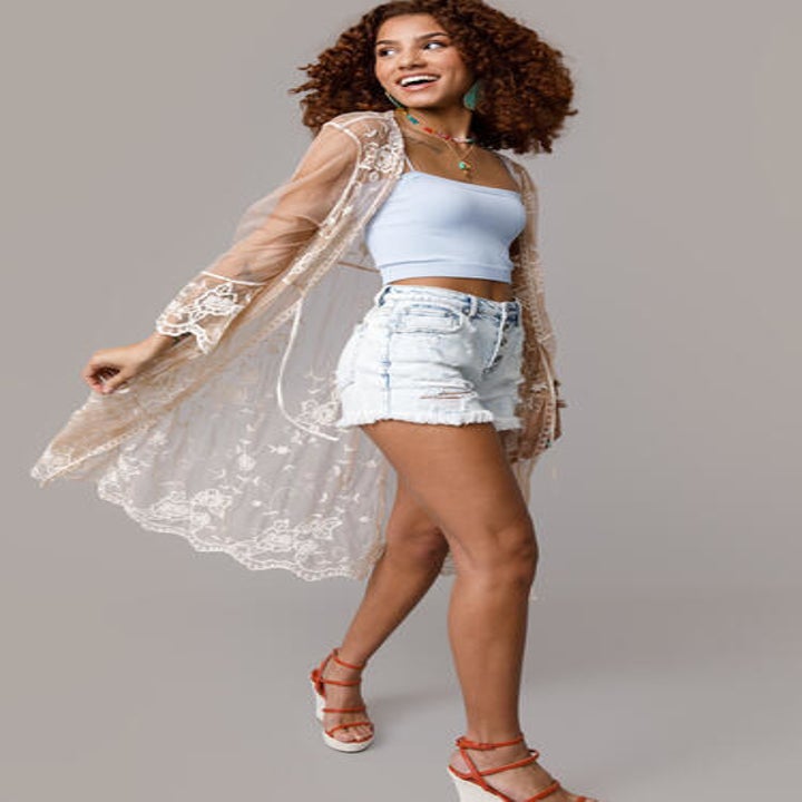 model in a white lace tie front kimono