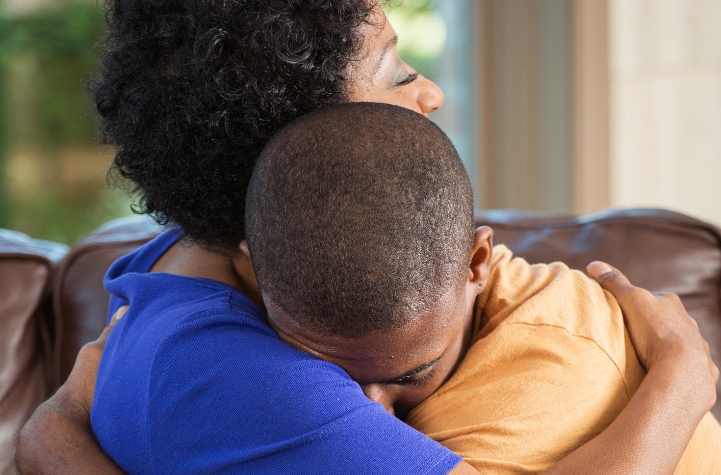 a mom and son hugging