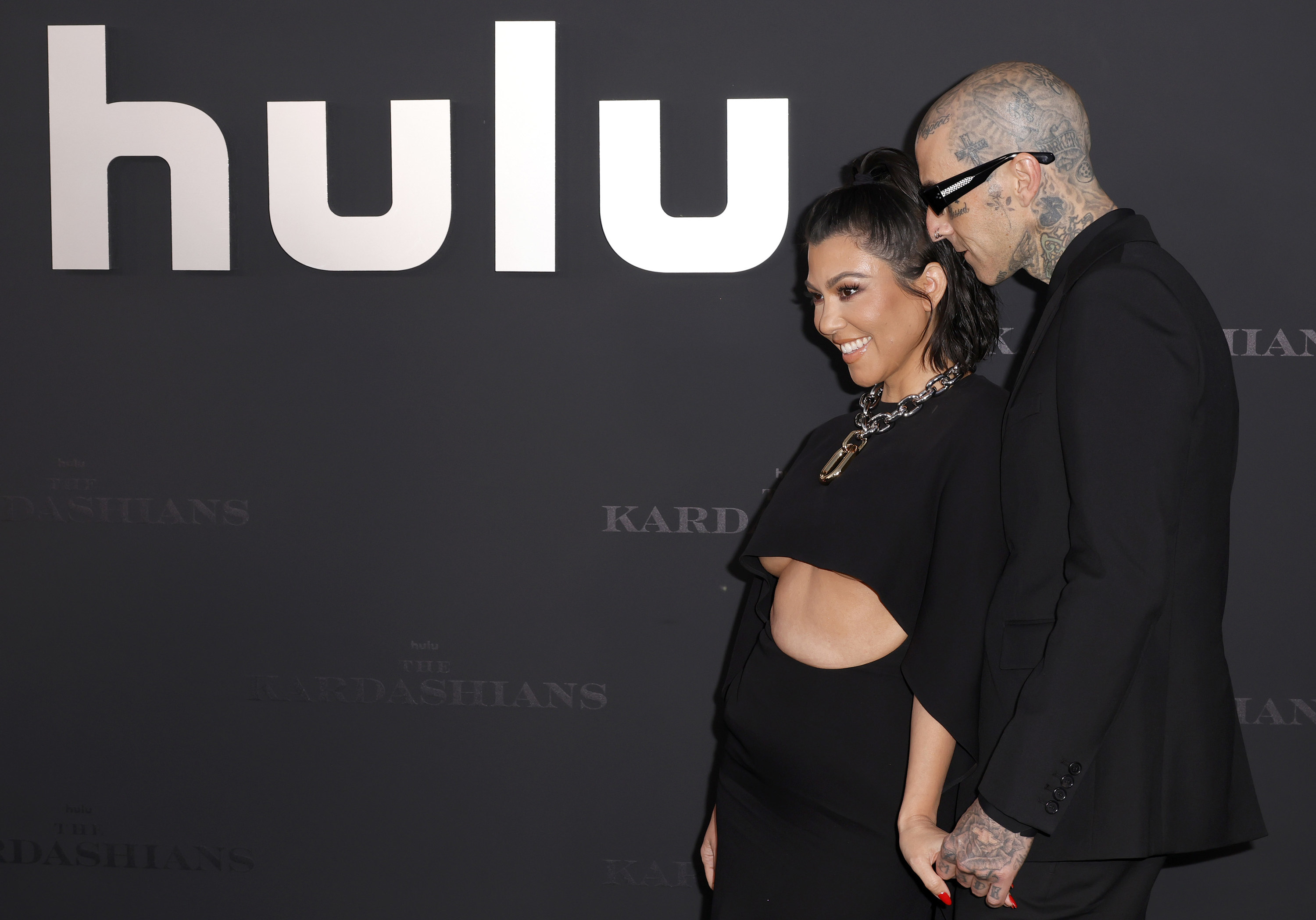 the couple holding hands at the Hulu premiere of the show