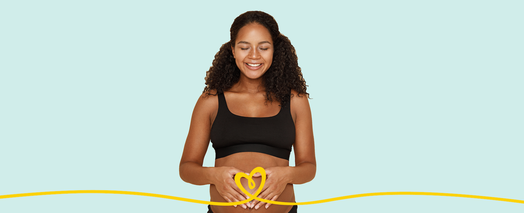 A Black, pregnant woman places her hands over her stomach with a swooping Pampers logo in frame