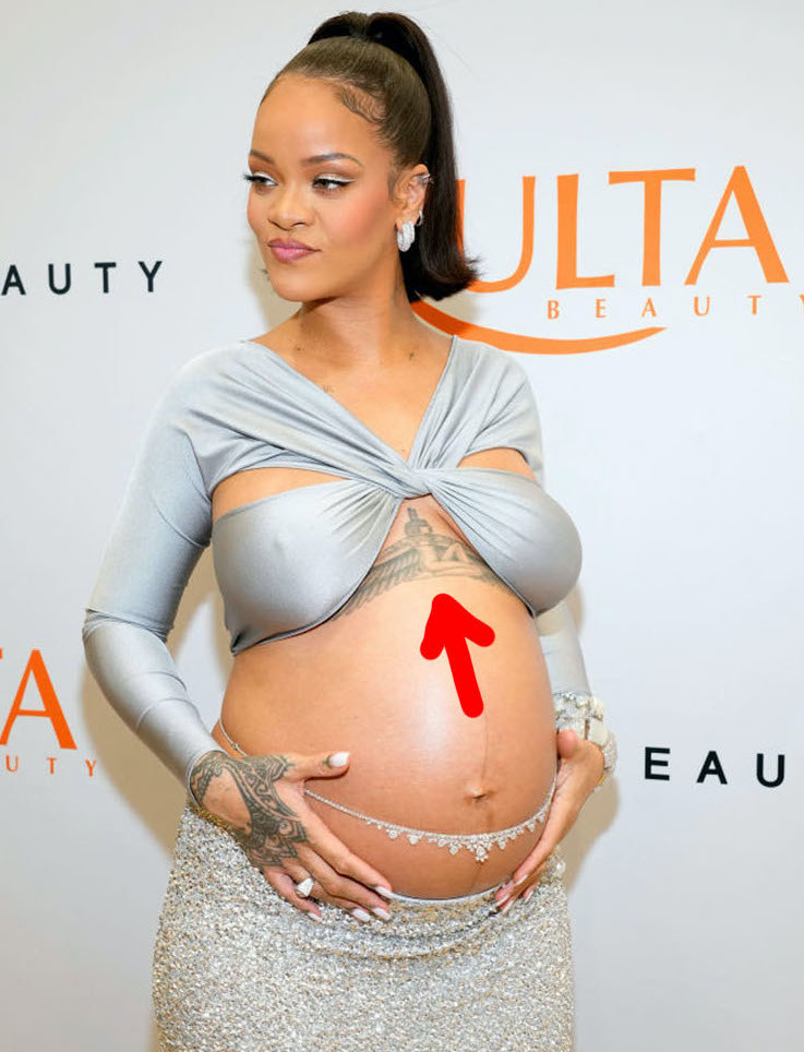 Rihanna with an arrow pointing to her tattoo
