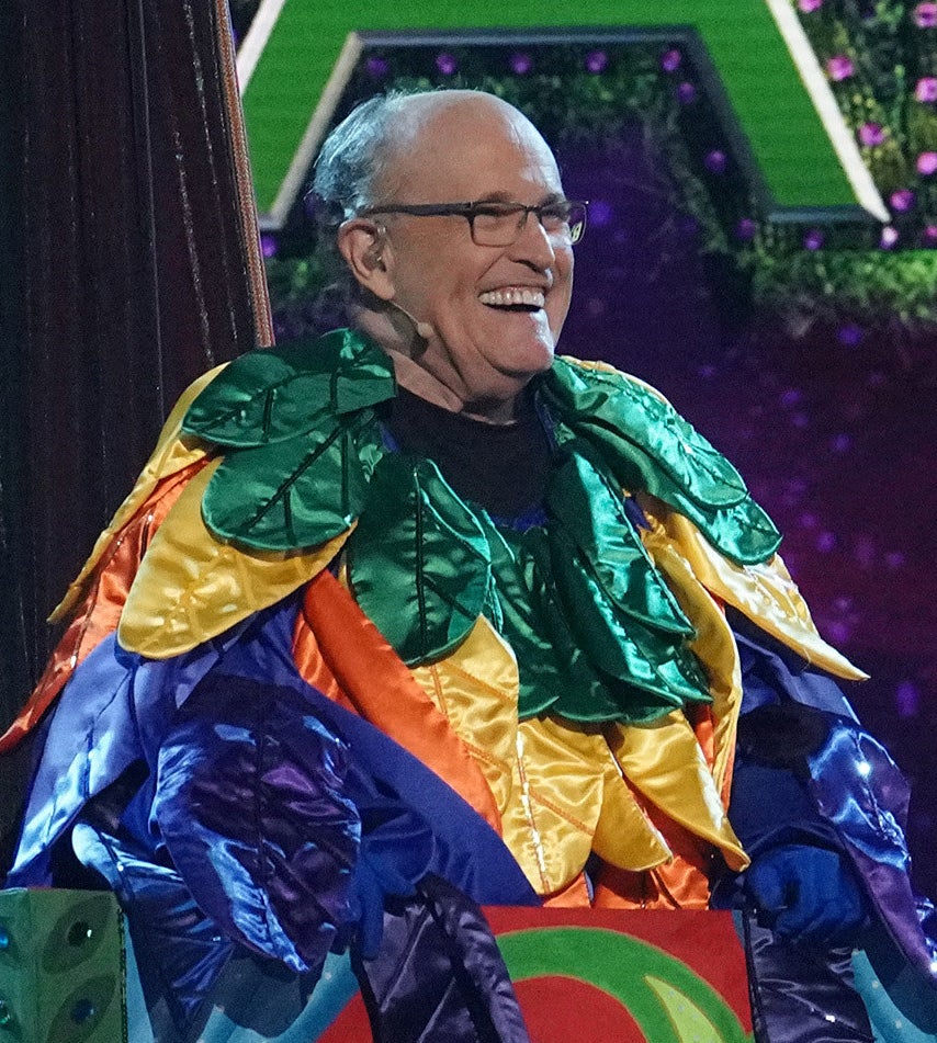 Rudy Giuliani laughs in the bird costume