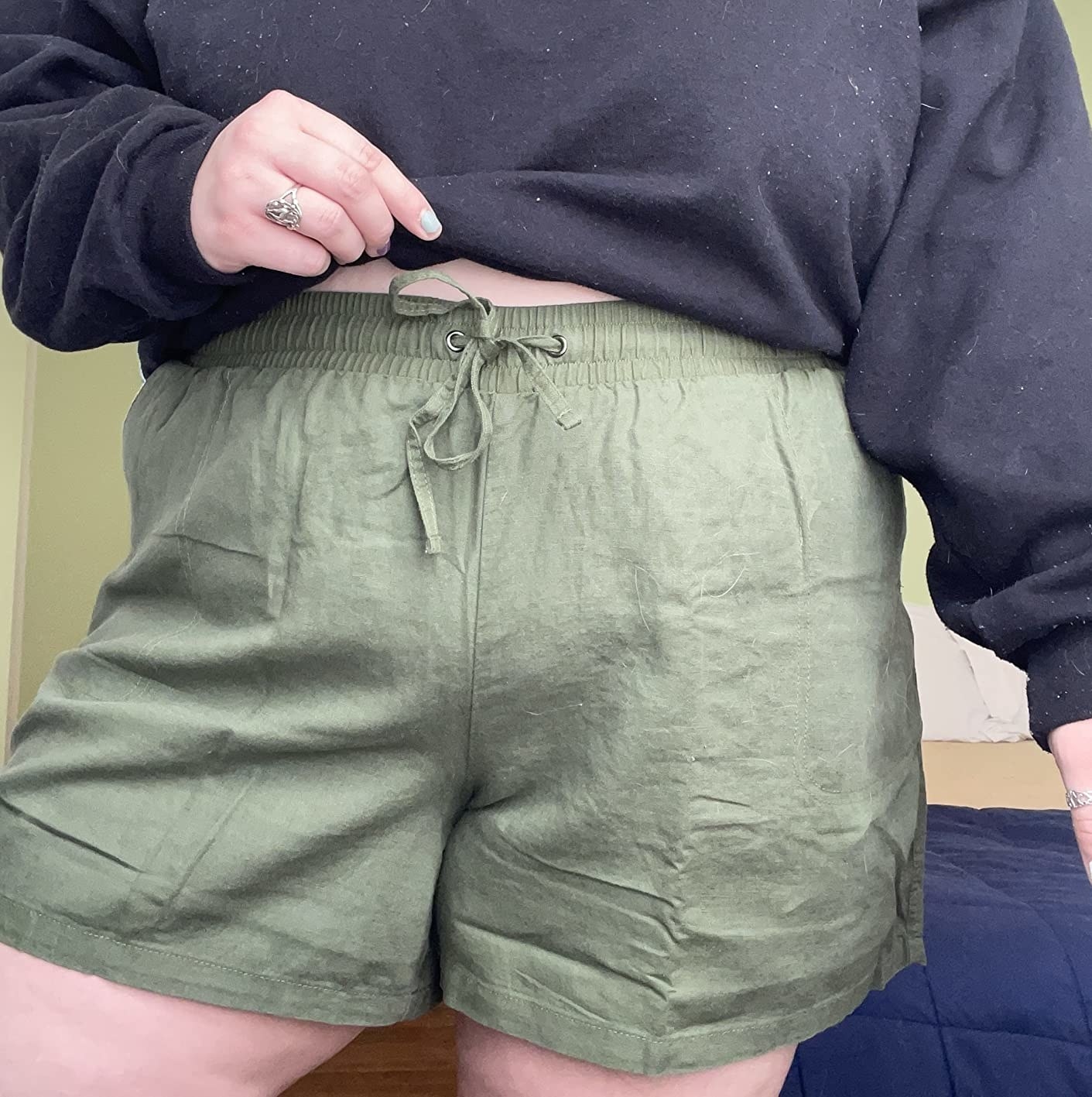 Reviewer wearing green shorts