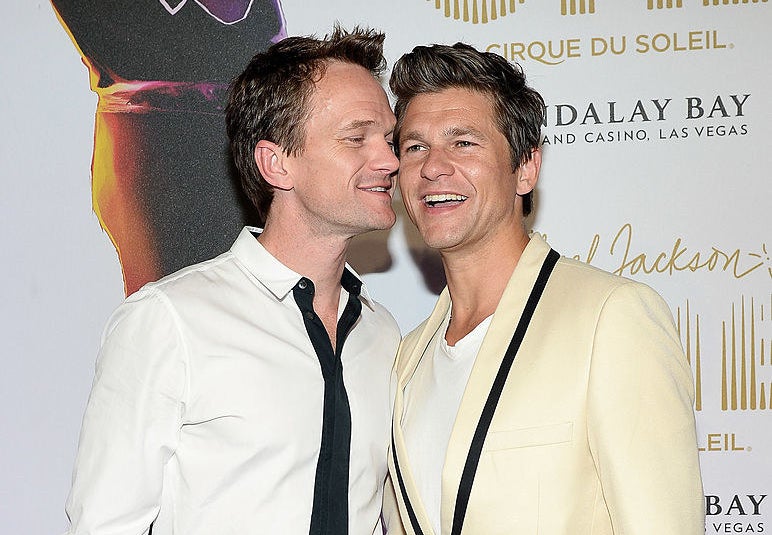 NPH and David posing together on a red carpet