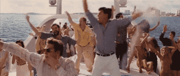 everyone dancing on a yacht in wolf of wall st