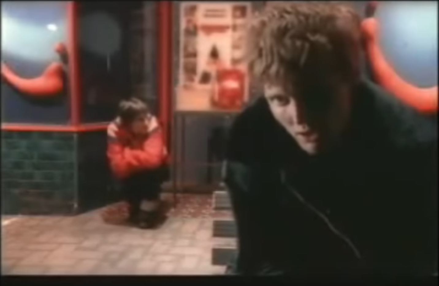 Kevin Mitchell looking sad on a street corner from the &#x27;Animal&#x27; video clip.