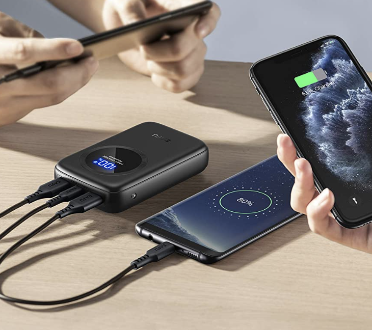 People holding up their devices that are plugged into the powerbank