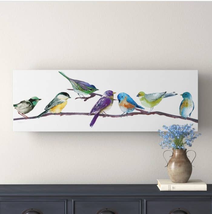 An image of a piece of wrapped canvas art with a bird design