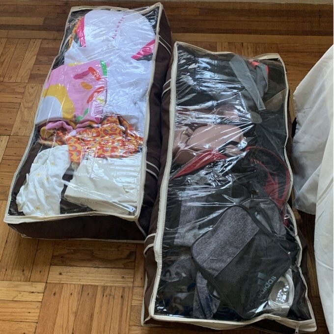 a reviewer photo of the containers full of clothes and bags