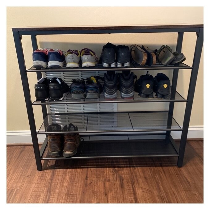 A five-tier shoe rack displaying various types of footwear, including sneakers, dress shoes, and sandals