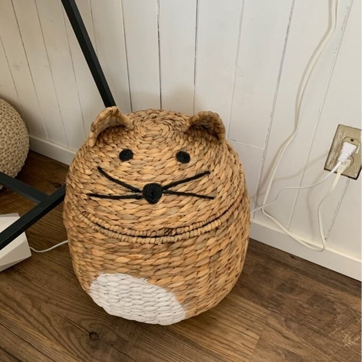 The woven cat shaped storage basket