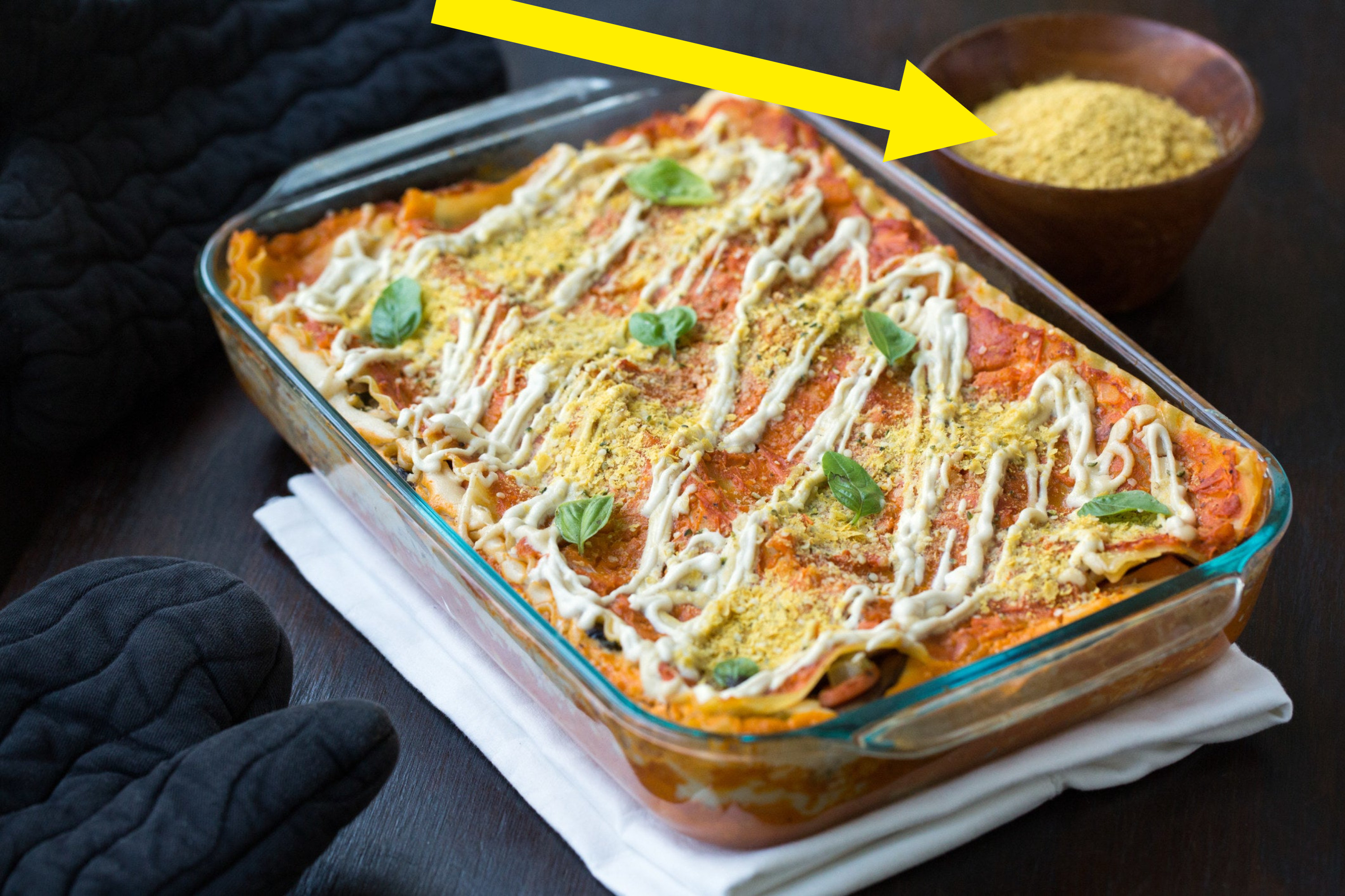 A lasagna topped with nutritional yeast.