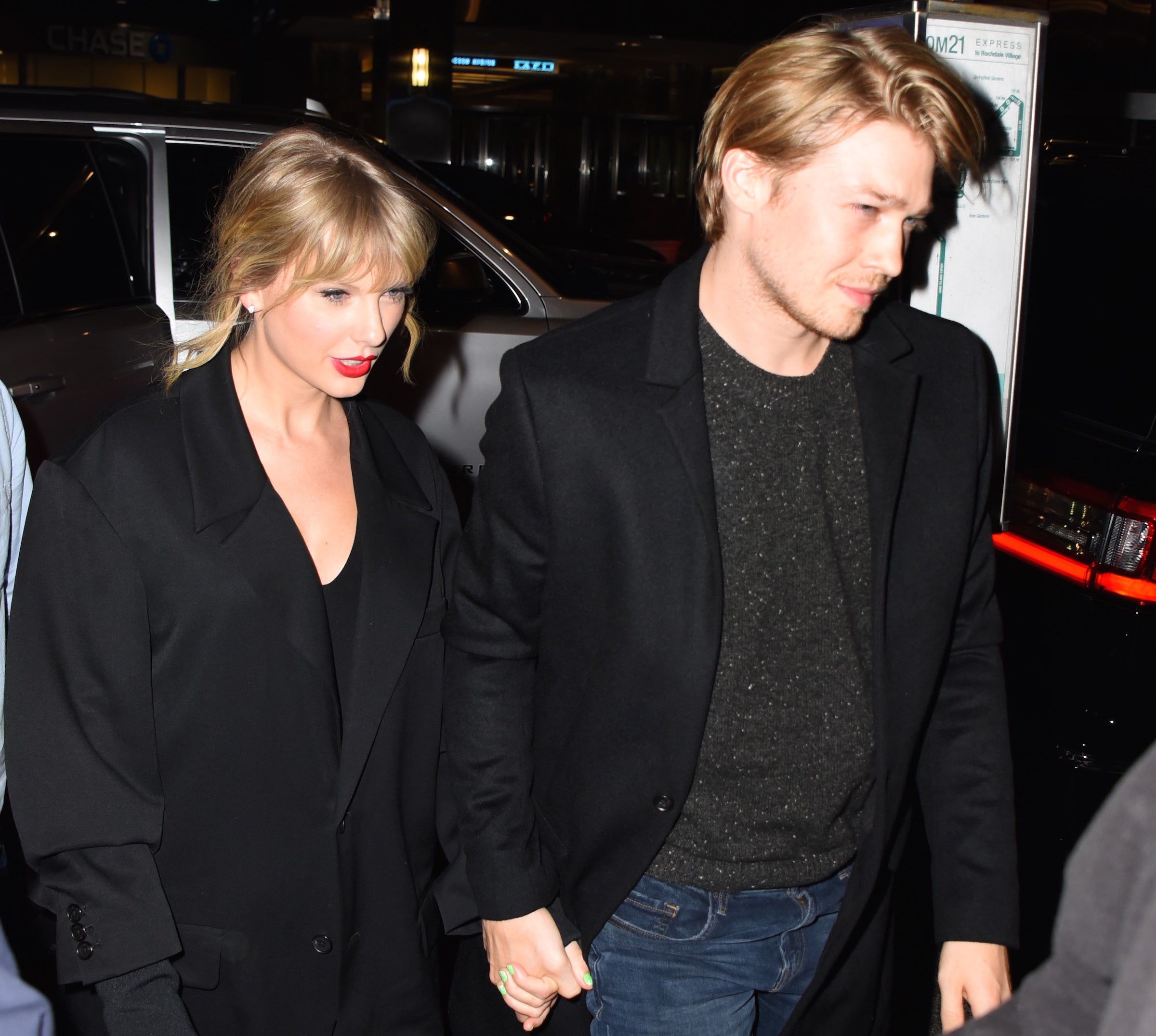 Taylor Swift and Joe Alwyn holding hands