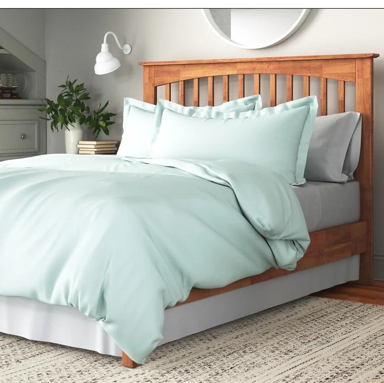 An image of a aqua microfiber duvet set that is durable, fade-resistant, and wrinkle-resistant