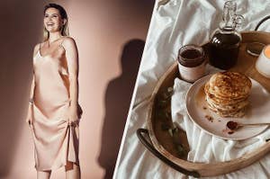 A person wearing a satin slip dress, a wooden tray on a bed with a plate of pancakes and syrup on it