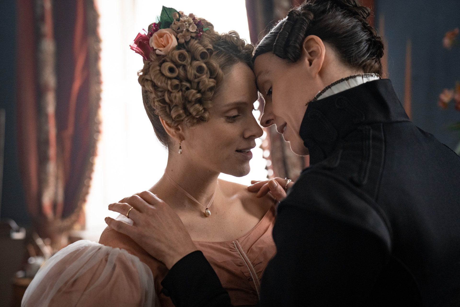 Sophie Rundle and Suranne Jones about to kiss in Gentleman Jack
