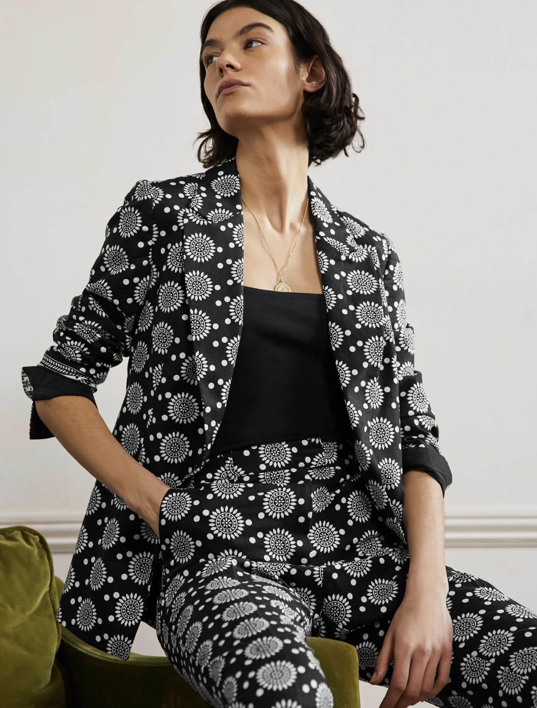 model wearing the blazer with black and white pattern and matching pants