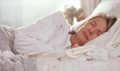 A GIF of Diane Keaton waking up and sobbing