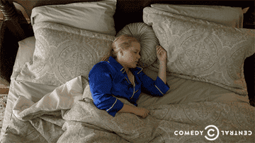 Amy Schumer waking up happily